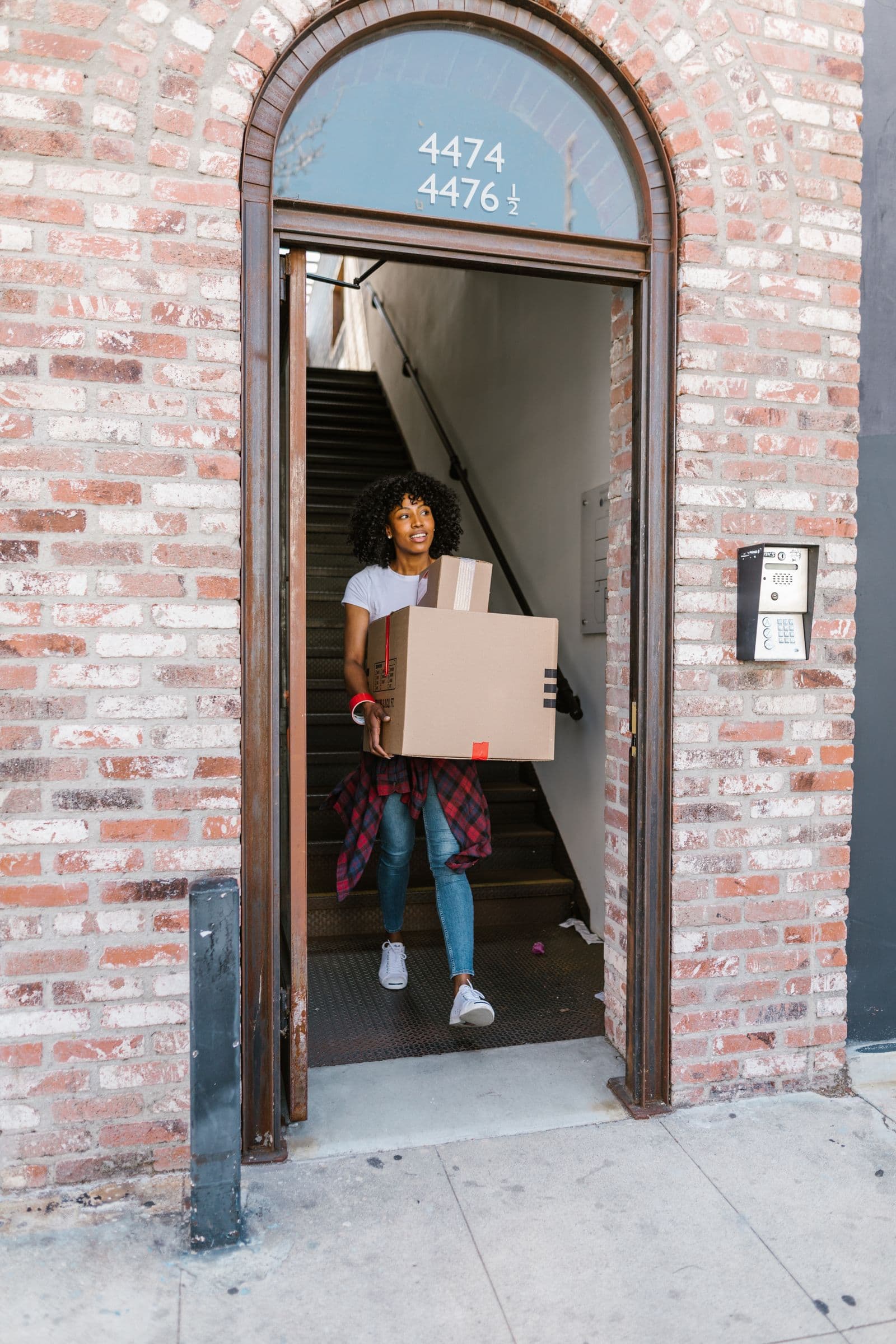 Movers carrying boxes together