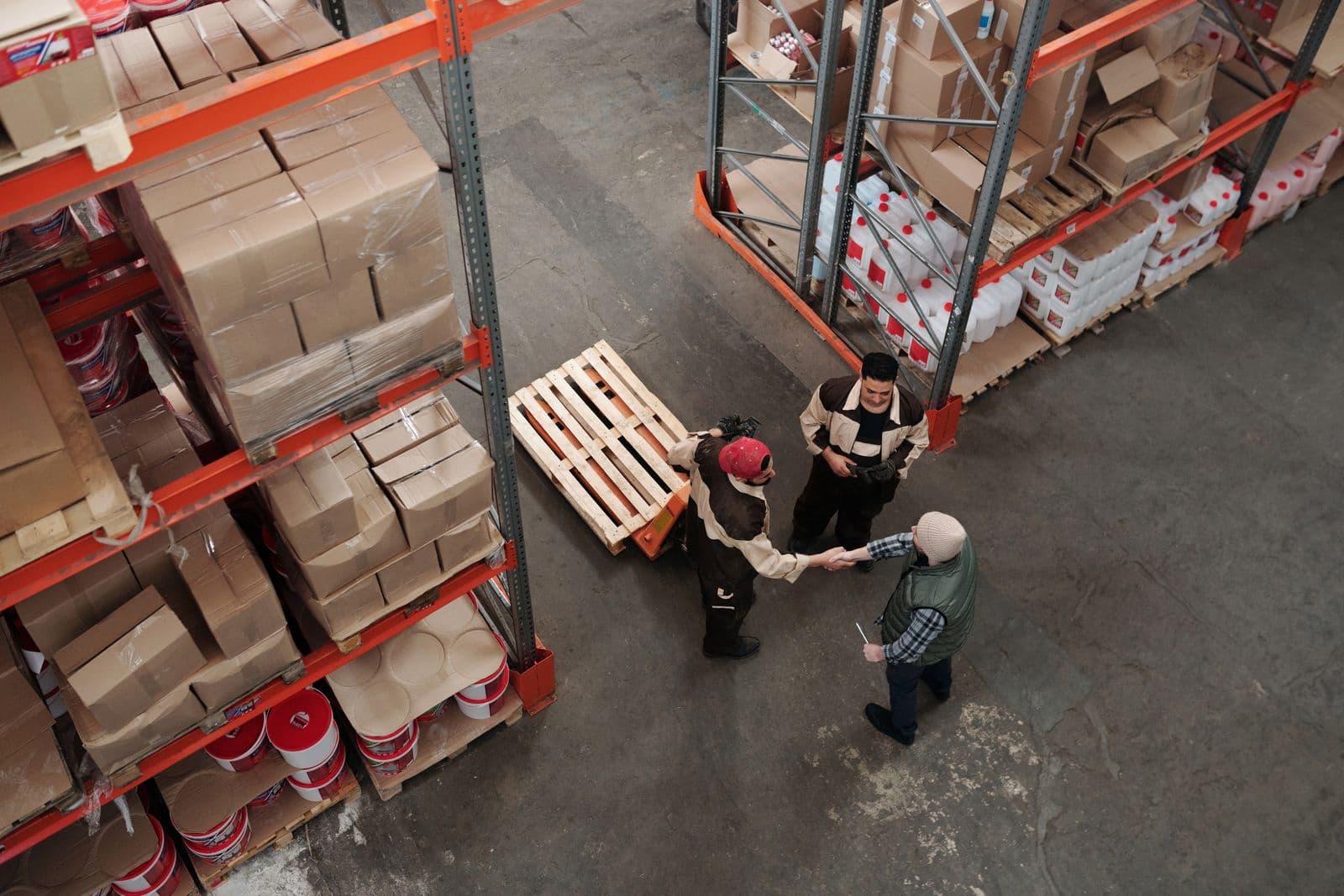 Uniformed crew working together to load equipment