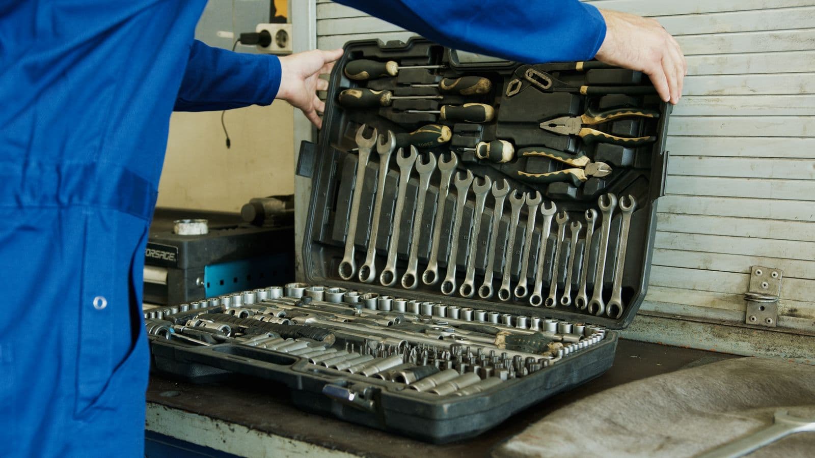 Technician's toolbox and tools laid out for a repair job