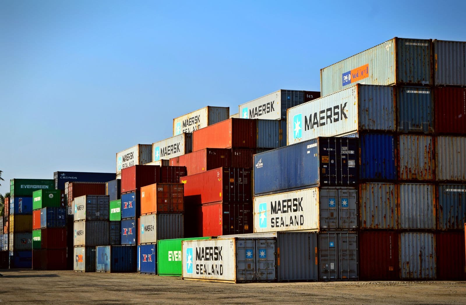 Shipping containers stacked at a port for international relocation